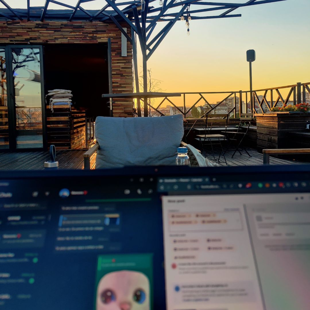 Working from a rooftop terrace at sunset